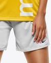 Female Soccer Player Wearing Jersey and Shorts Mockup