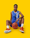 Female Basketball Player Wearing V-Neck Jersey and Shorts Mockup