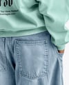 Black Man Wearing an Oversize Sweatshirt and Wide Jeans Mockup
