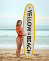 Woman Wearing Bodysuit Holding Surfboard Mockup