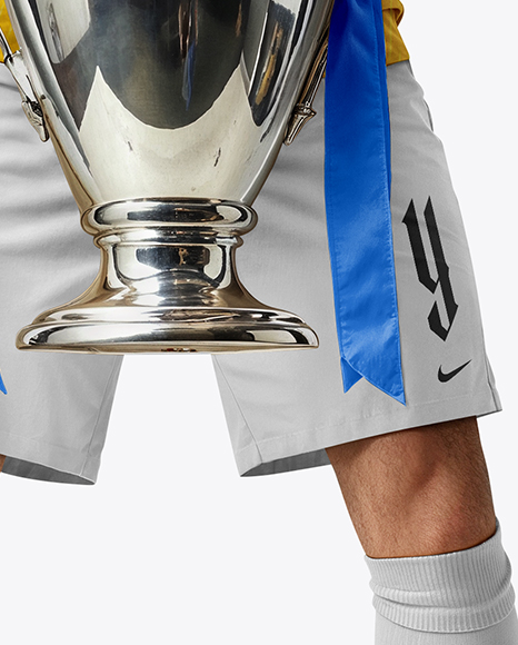 Man Wearing Soccer Jersey and Shorts Holds Cup Mockup