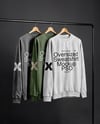 Three Sweatshirts on a Black Rack Against a Plain Background Mockup