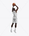 Basketball Player Wearing Jersey and Shorts Throwing Basketball Mockup