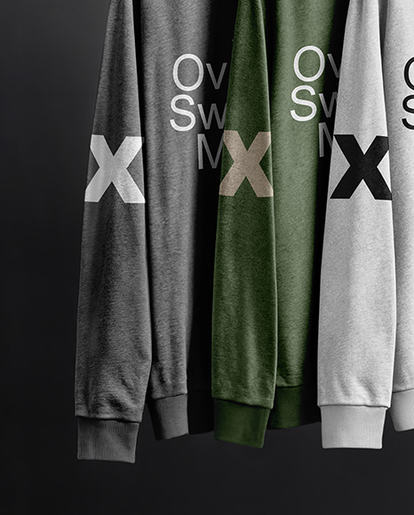Three Sweatshirts on a Black Rack Against a Plain Background Mockup