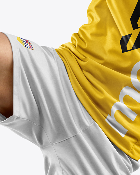Man Wearing Soccer Jersey and Shorts Mockup