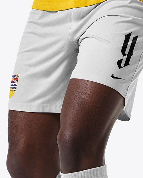 Soccer Player Wearing Raglan Jersey and Shorts Mockup