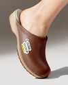 Pair of Clogs on Woman's Legs with Skirt Mockup