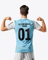 Man Wearing Soccer Jersey and Shorts Mockup