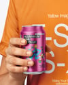 Man Wearing a T-shirt Holding 12oz Drink Can Mockup