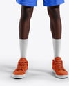 Basketball Player Wearing a V-Neck Jersey and Shorts Holding a Basketball Mockup