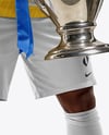 Soccer Player Wearing Jersey and Shorts Holds Cup Mockup