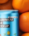 8.5oz Slim Drink Can on a Stack of Oranges Mockup