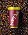 16oz Paper Cup on a Stack of Coffee Beans Mockup