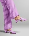 Pair of Suede Mules on Woman's Legs Mockup