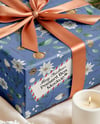 X-mas Gift Box with Bow and Decorations on Background Mockup