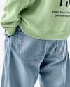 Man Wearing an Oversize Sweatshirt and Jeans Mockup