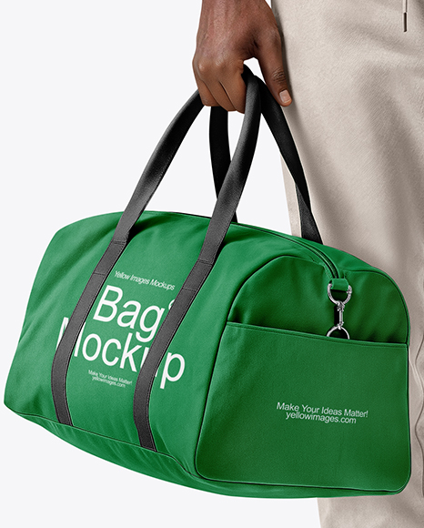 Man Wearing T-Shirt and Sweatpants Holding Duffle Bag Mockup