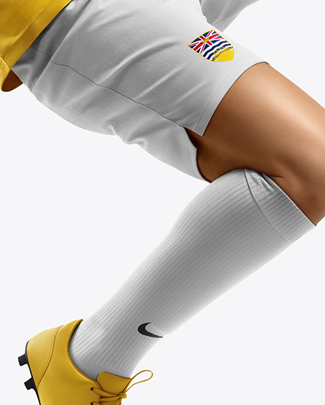 Man Wearing Soccer Jersey and Shorts Mockup