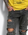 Young Man with Tattoo Wearing T-shirt and Ripped Jeans Mockup