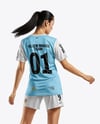 Female Soccer Player Wearing Jersey and Shorts Mockup