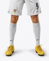 Man Wearing Soccer Jersey and Shorts Mockup