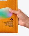 Postage Bag in a Hand Mockup