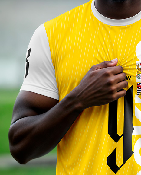 Soccer Player Wearing a Crew Neck Jersey and Shorts at the Stadium Mockup