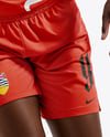 Female Basketball Player Wearing V-Neck Jersey and Shorts Mockup
