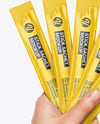 Five Sachets in a Hand Mockup