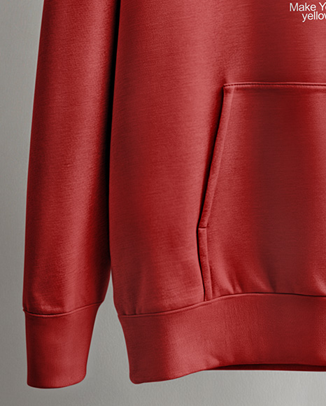 Hoodie on a Wooden Hanger Against a Plain Background Mockup