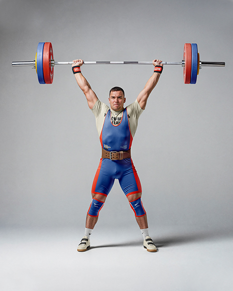 Man Wearing Weightlifing Suit with Barbell Mockup
