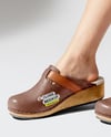 Pair of Clogs on Woman's Legs Sitting on Stool Mockup