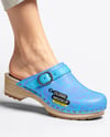 Pair of Clogs on Woman's Legs Sitting on Stool Mockup