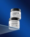 Two Glossy Cosmetic Jars on the Glass Mockup