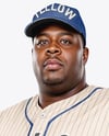 Black Man Wearing a Full Baseball Kit Mockup