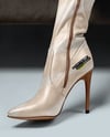 Pair of Over-The-Knee Boots on Women's Legs on Sofa Mockup