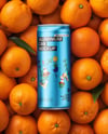 8.5oz Slim Drink Can on a Stack of Oranges Mockup