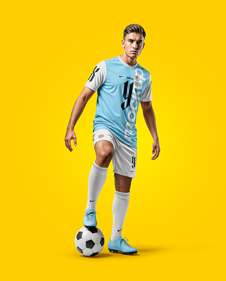 Man Wearing Soccer Jersey and Shorts Mockup