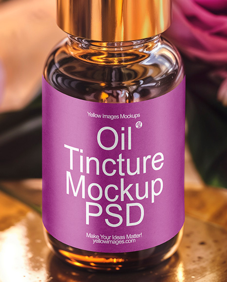 Amber Dropper Bottle with Oil Tincture Surrounded by Flowers Mockup