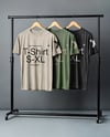 Three T-Shirts on a Wooden Hanger Against a Plain Background Mockup