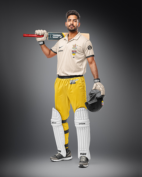 Indian Man Wearing Full Cricket Kit with Bat Mockup