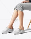 Pair of Clogs on Woman's Legs Sitting on Stool Mockup