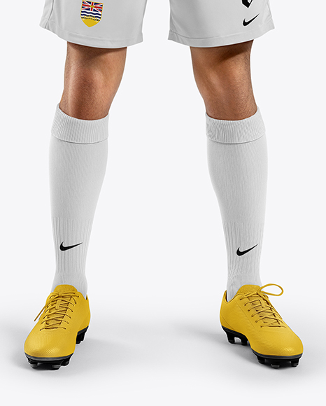 Man Wearing Soccer Jersey and Shorts Mockup