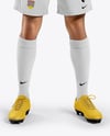 Man Wearing Soccer Jersey and Shorts Mockup