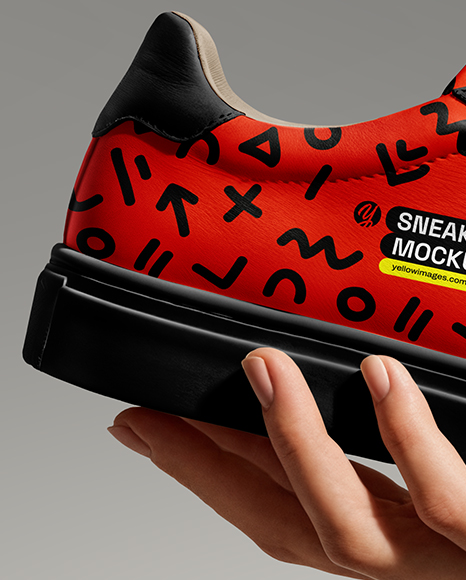 Woman's Hand Holding Sneaker Mockup