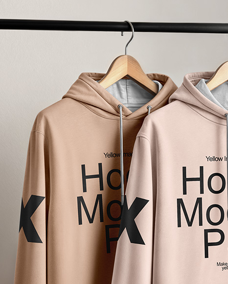 Two Hoodies on a Wooden Hanger Against a Plain Background Mockup
