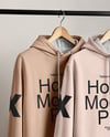 Two Hoodies on a Wooden Hanger Against a Plain Background Mockup