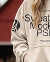 Young Woman in Sweatshirt and Joggers Standing on Hay Block at Pumpkin Patch Mockup