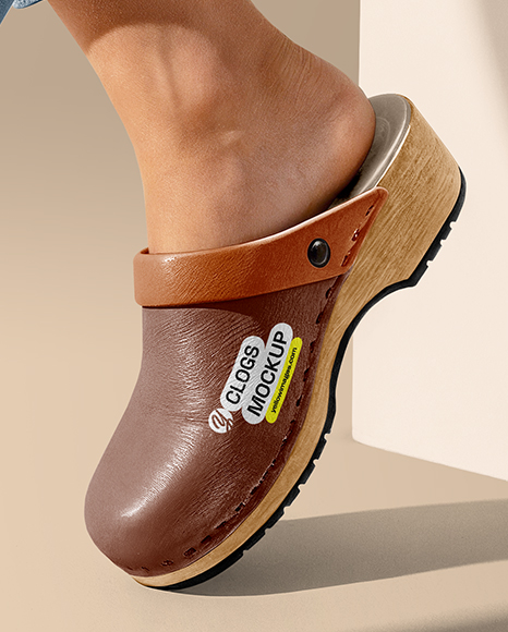 Pair of Clogs on Woman's Legs Sitting on Block Mockup