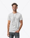 Smiling Man Wearing T-Shirt with Badge Mockup